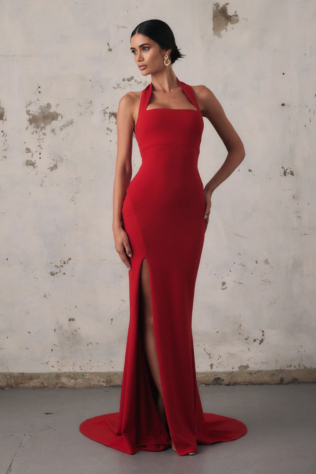 Nookie Boulevard Gown in red, elegant dress with a flowing design, showcased on a model against a neutral background.