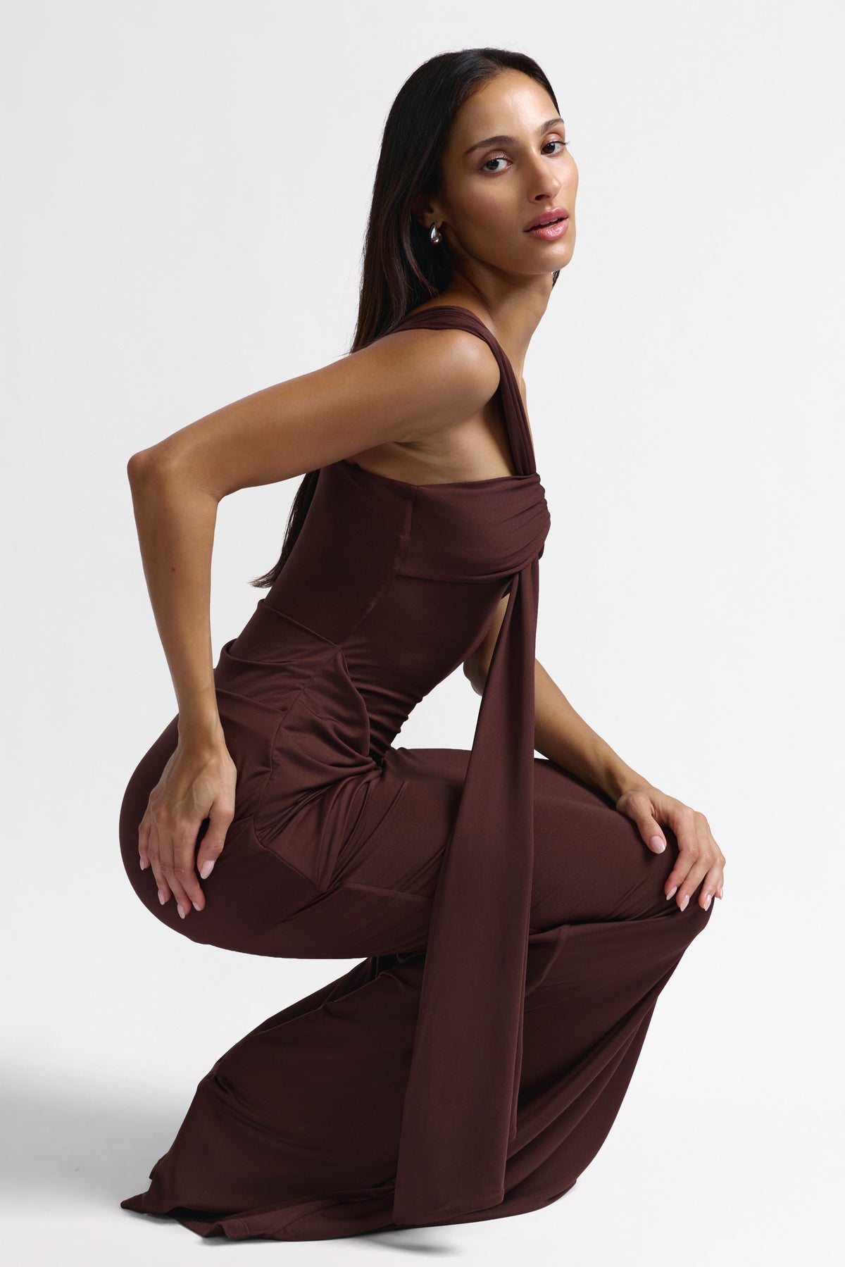 Nyla Chocolate dress by Studio Lexi featuring a stylish, fitted design in rich chocolate color, displayed on a hanger.