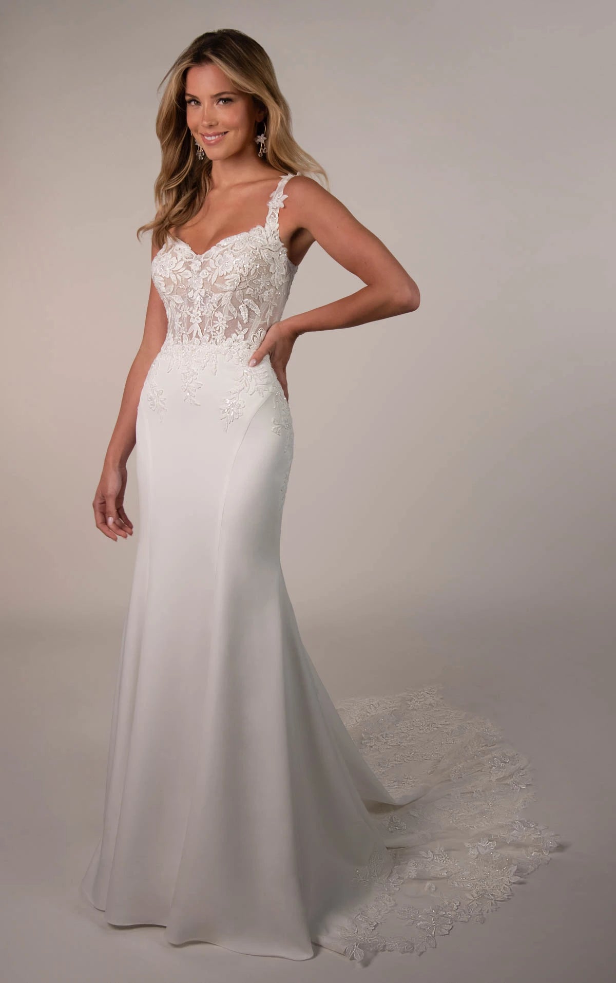 Elegant Stella York Luca wedding gown with intricate lace details and a flowing train, perfect for a romantic bridal look.