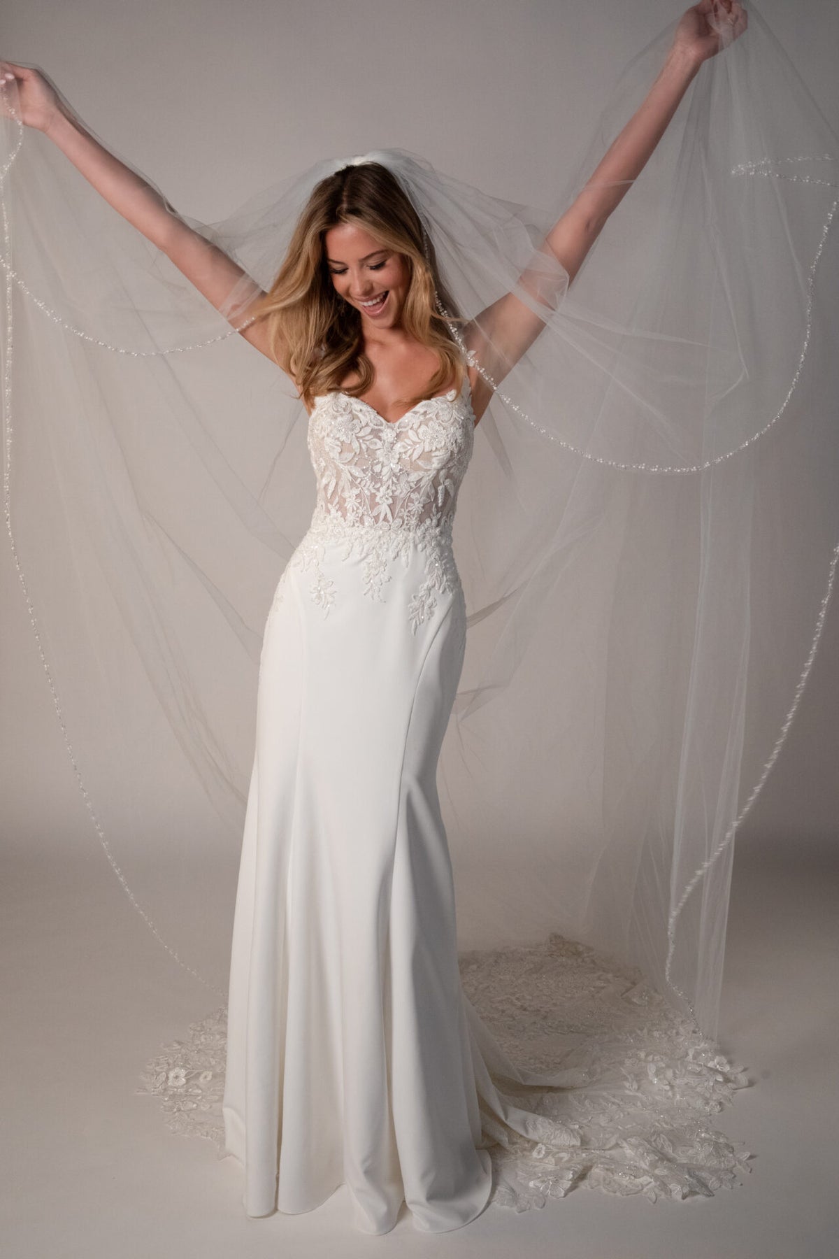 Stella York Luca wedding gown with lace details and elegant silhouette, photographed on a mannequin.