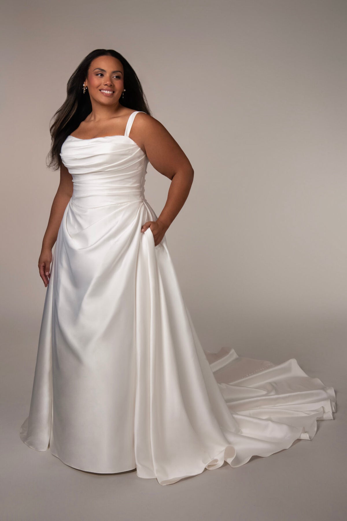 Elegant Stella York Marion wedding gown with lace details and flowing train, perfect for a romantic bridal look.