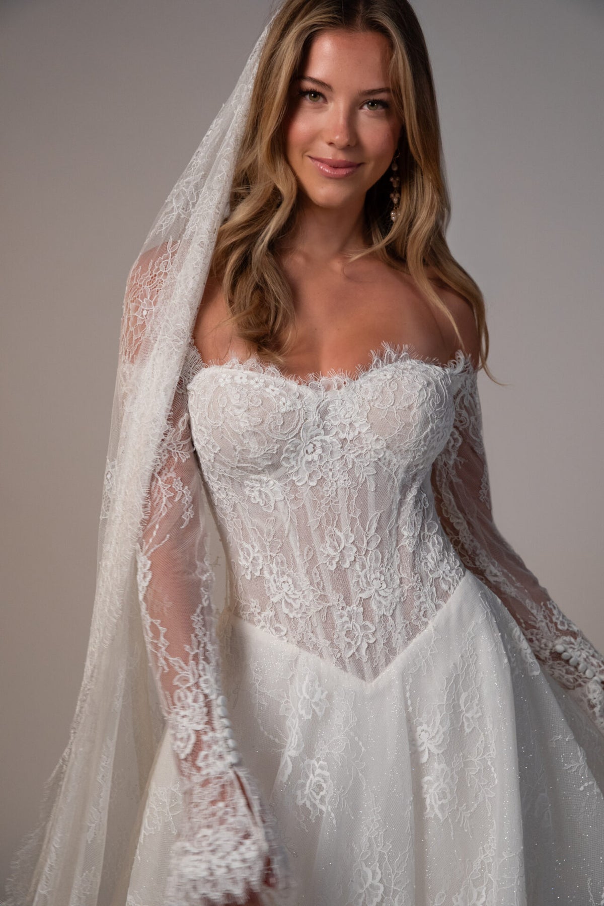 Stella York Meadowbank wedding gown with lace details, fitted silhouette, and elegant train, arriving November.