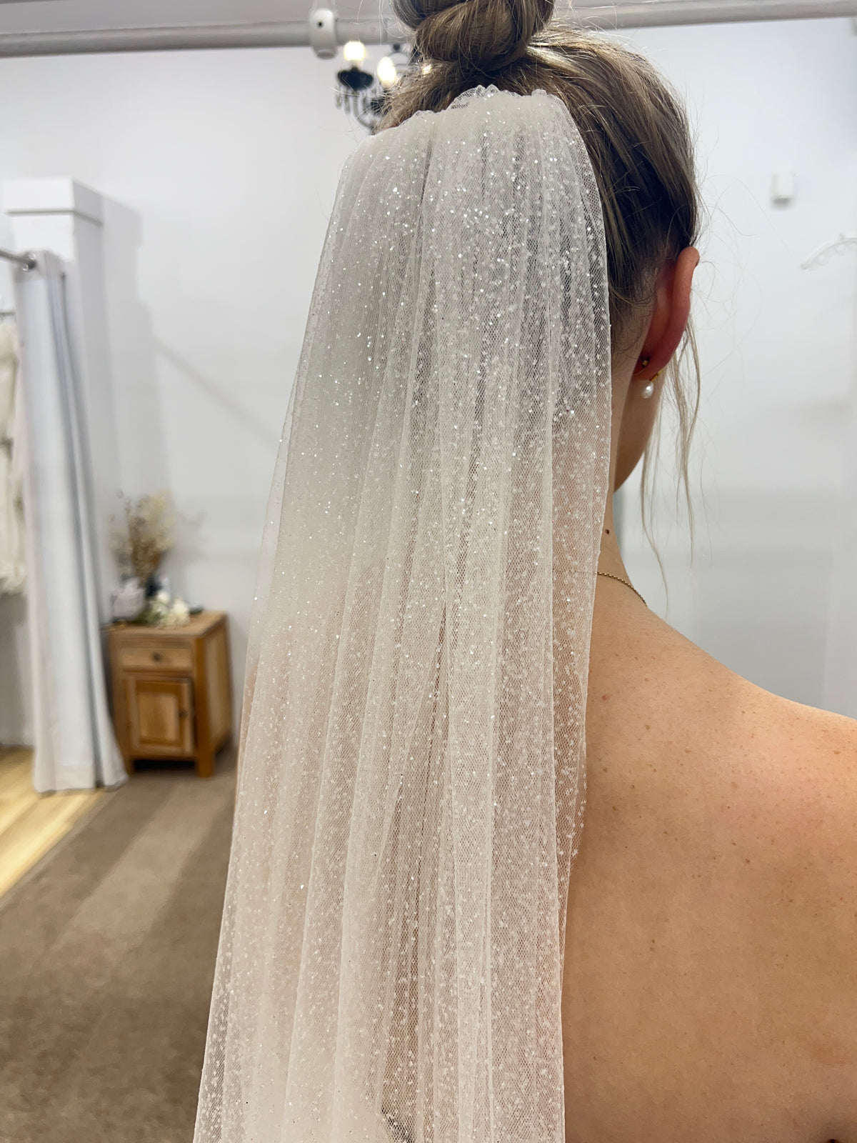 Ivory Starlight Glitter Veil by Aus Veils, floor-length bridal accessory with shimmering glitter details.