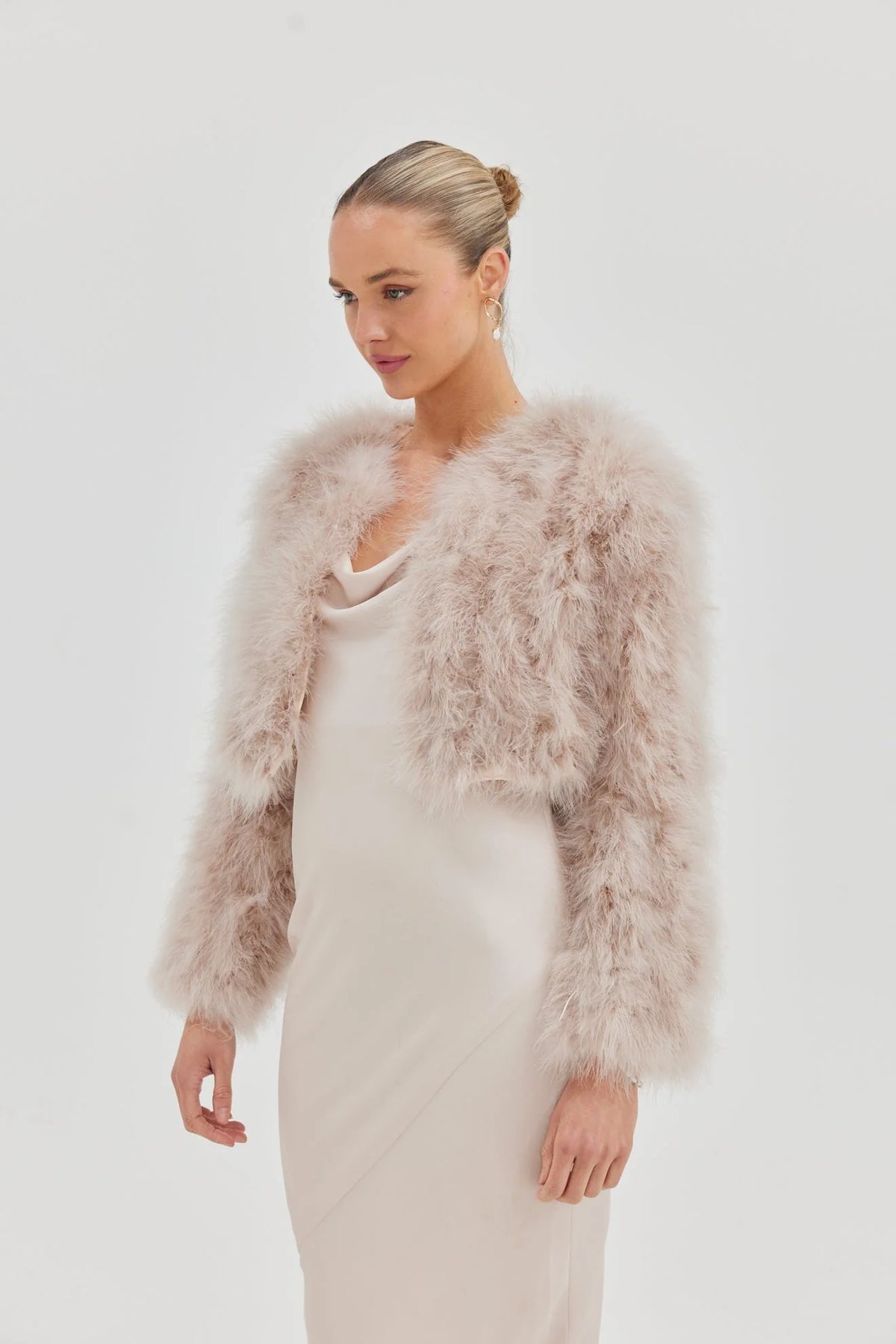 Blush Manhattan Crop Jacket by Bubish, a stylish accessory with a fitted design and soft fabric, shown in a close-up view.