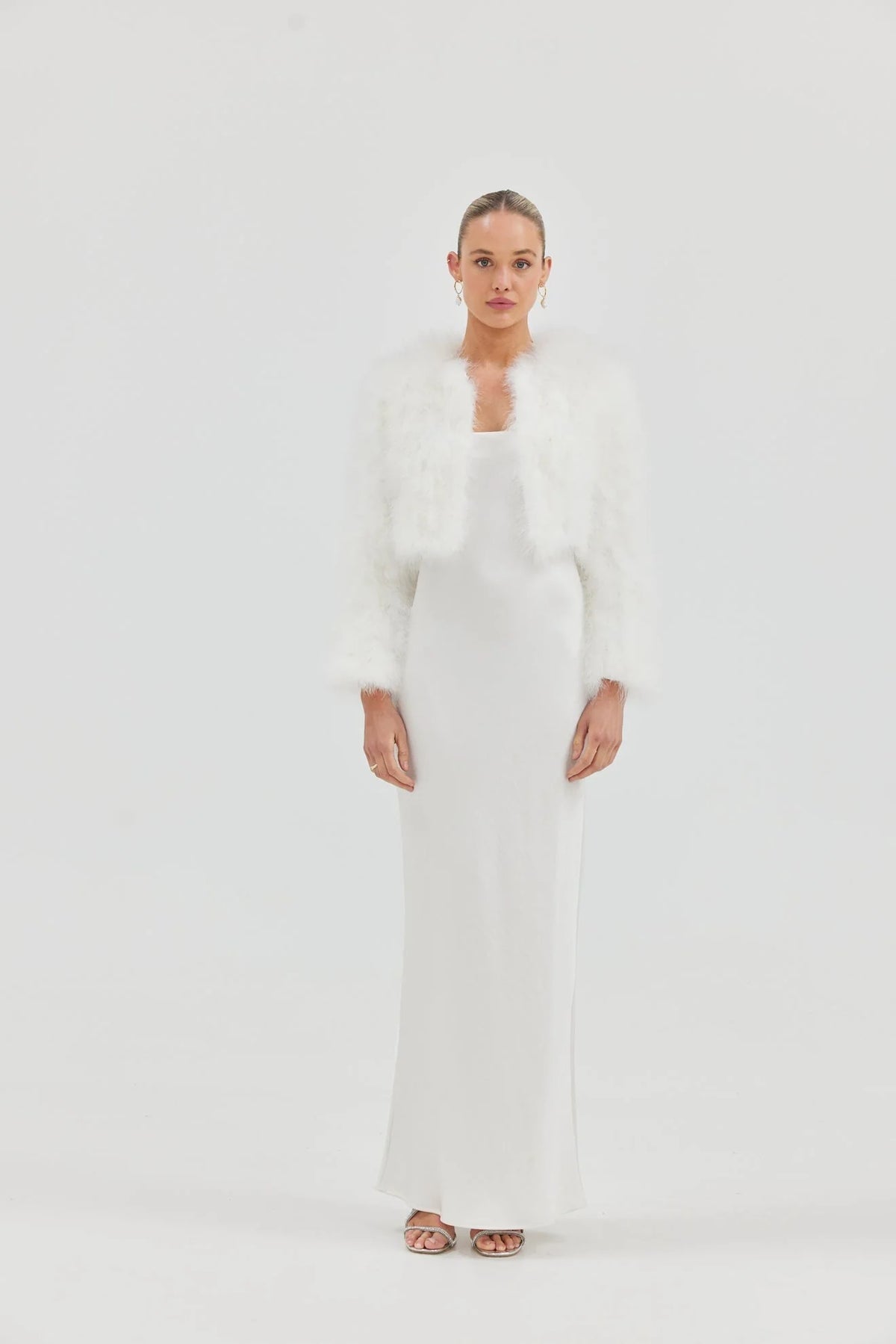 White Manhattan Crop Jacket by Bubish, cropped accessory jacket with a stylish fit, shown in a close-up image.